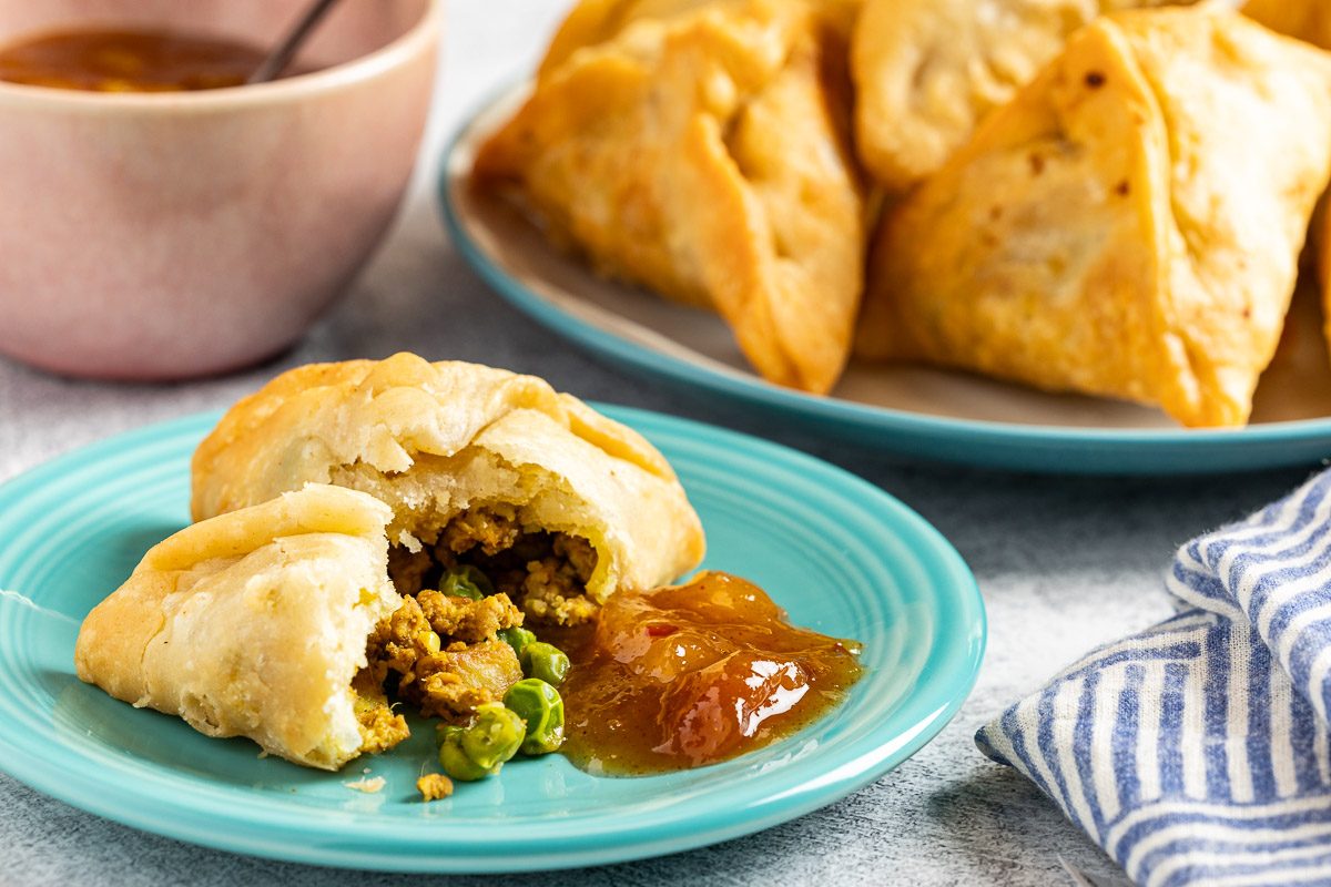 Taste of Home Chicken Samosa photo of the finished recipe served on plates.
