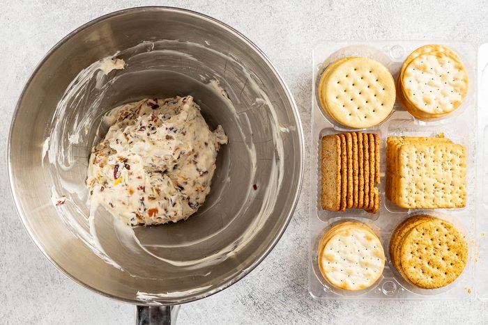 Taste of Home Cranberry Cream Cheese Spread photo of the combined ingredients with assorted crackers.