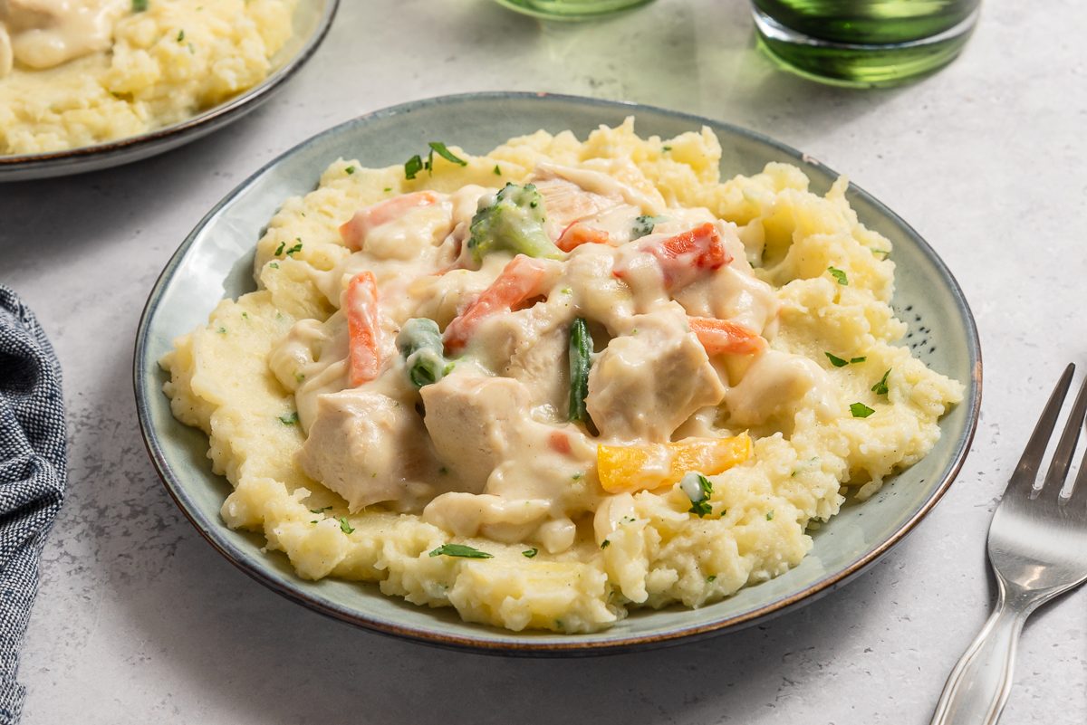 Creamed Turkey Over Mashed Potatoes Inside Plates