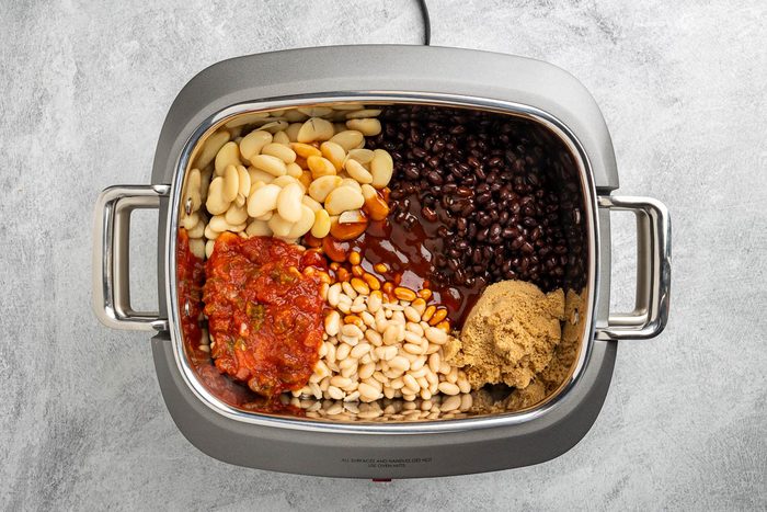 Taste of Home Crockpot Baked Beans recipe photo of all the ingredients in the crockpot.