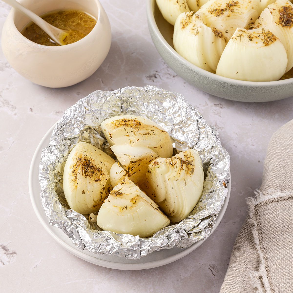 Grilled onions served in small plate and serving dish.