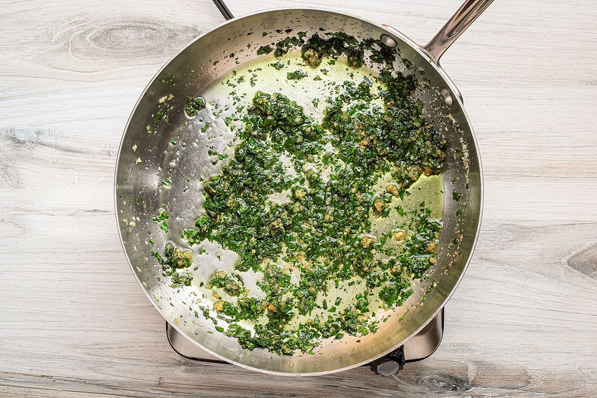 The olive oil, garlic, herbs and seasonings in the skillet, for a garlic spaghetti (aglio e olio) recipe from Taste of Home.