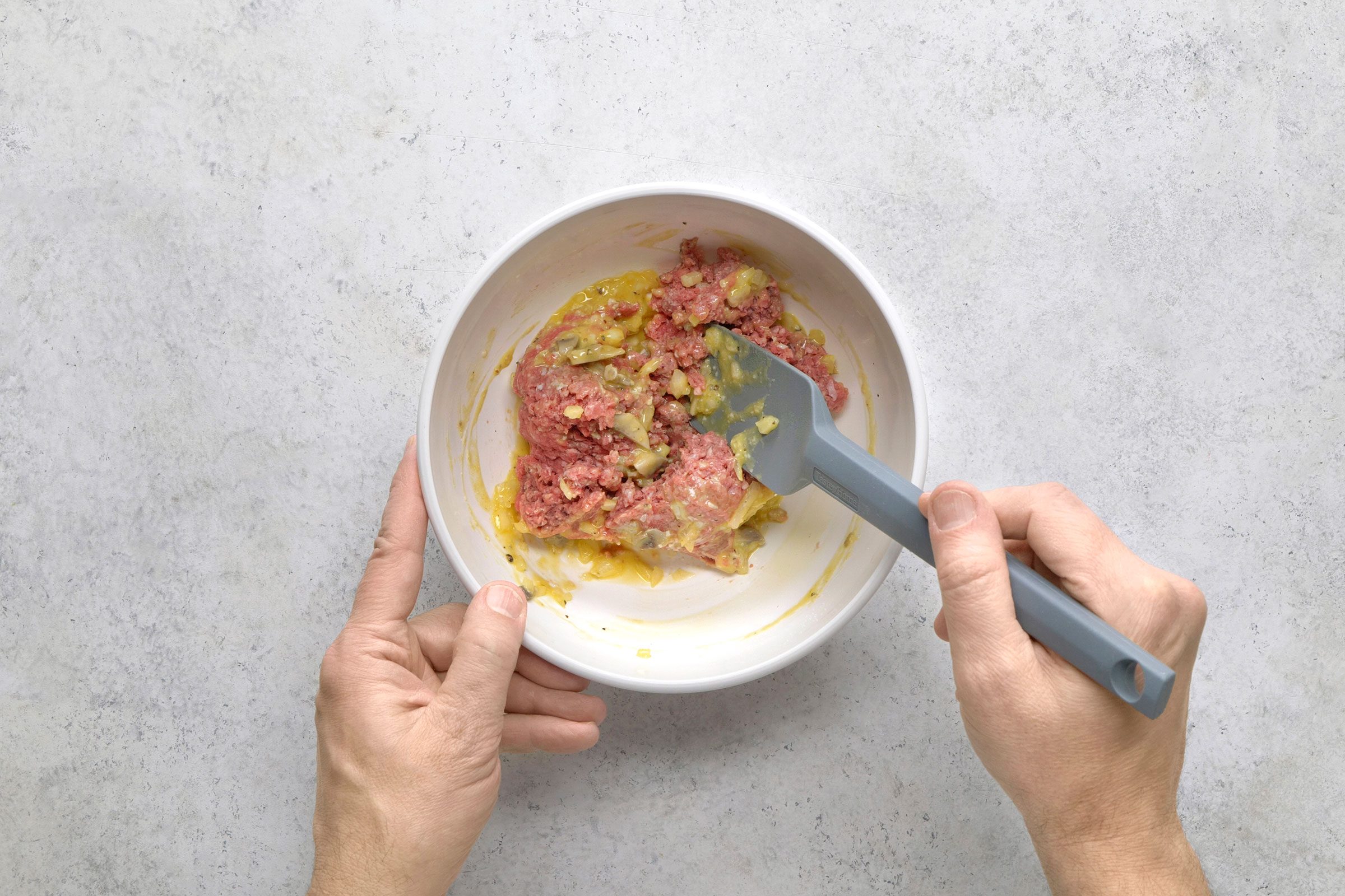 Crumbled beef over egg mixture