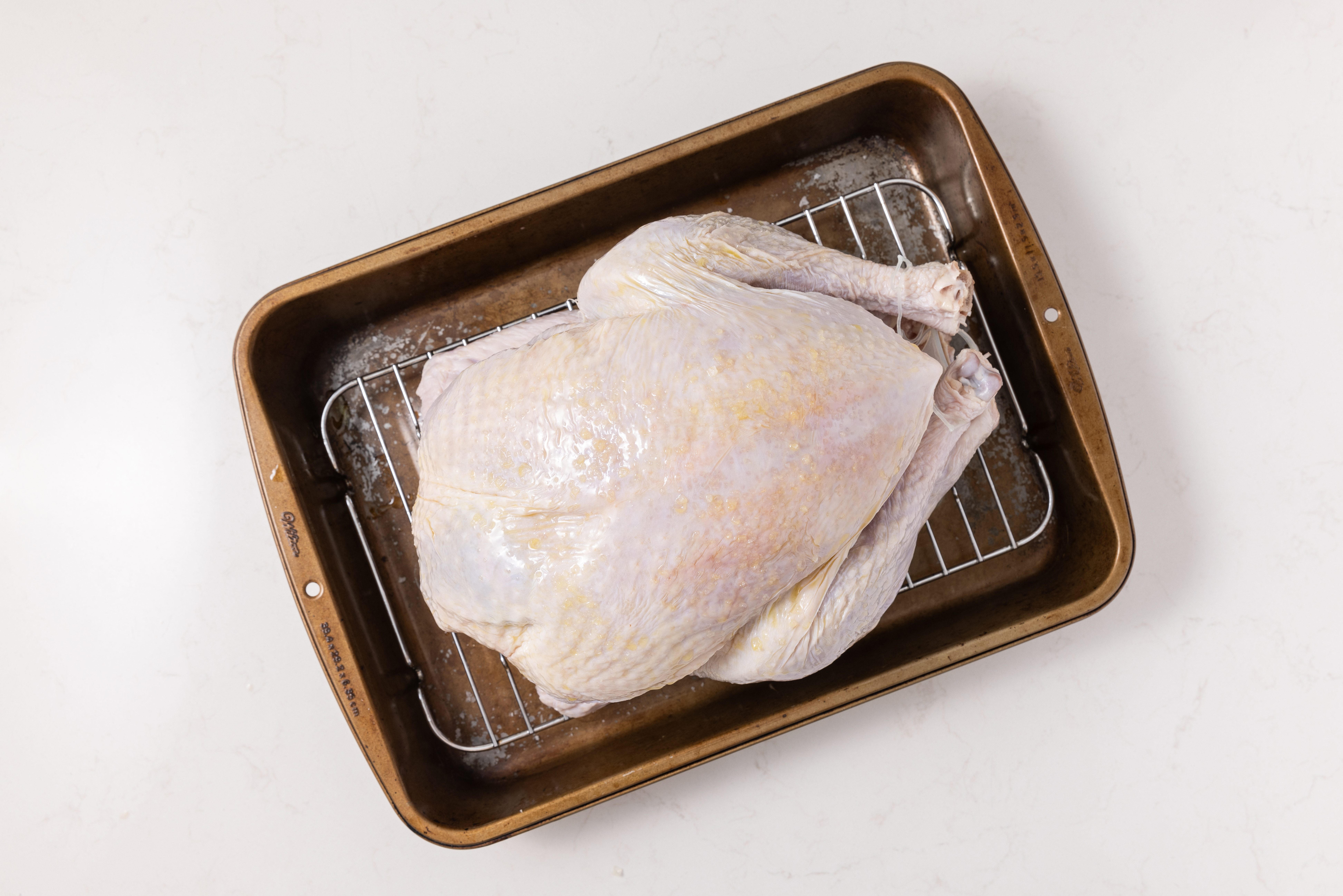 Turkey in baking tray ready to go in the oven.