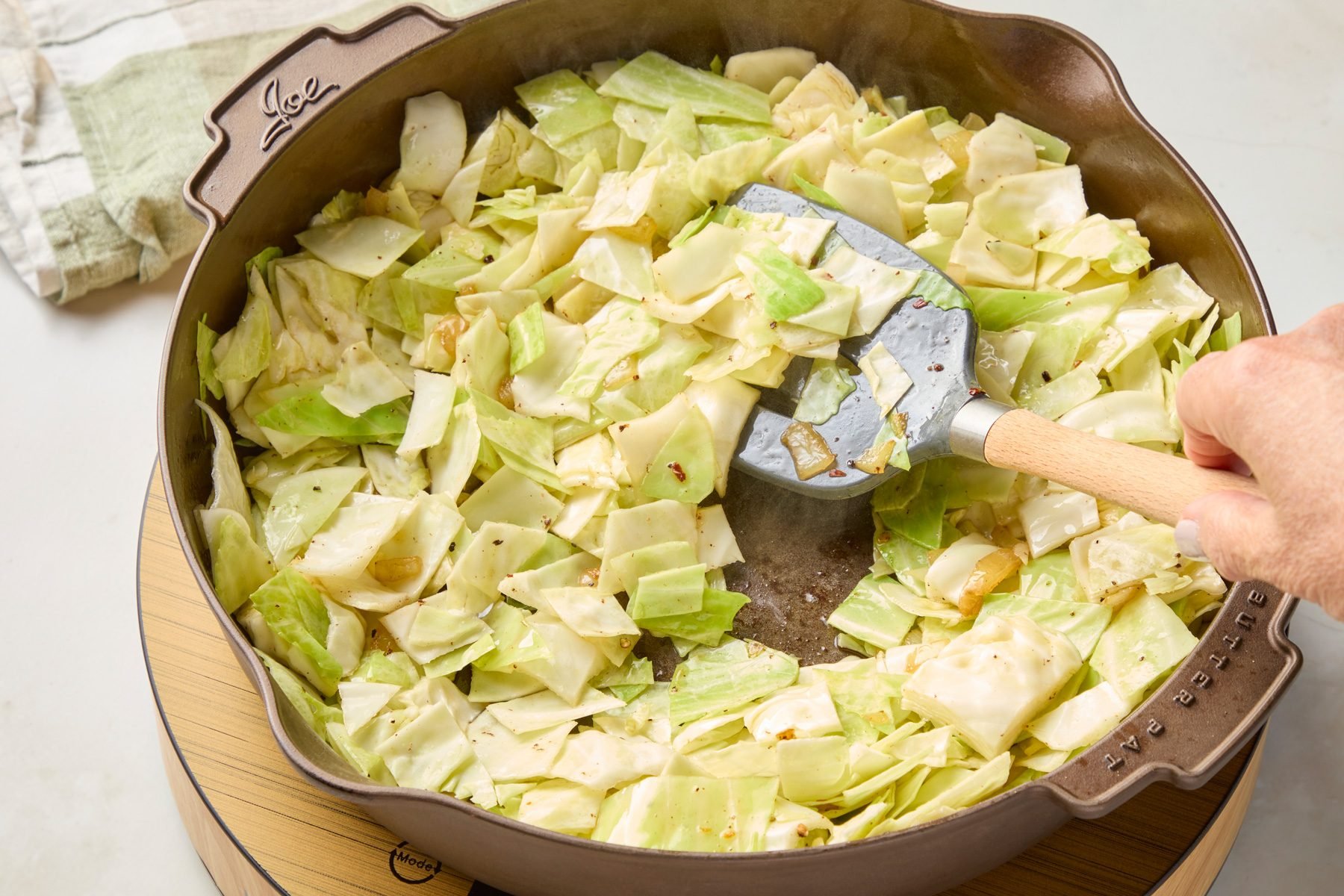 Add cabbage and water; cook
