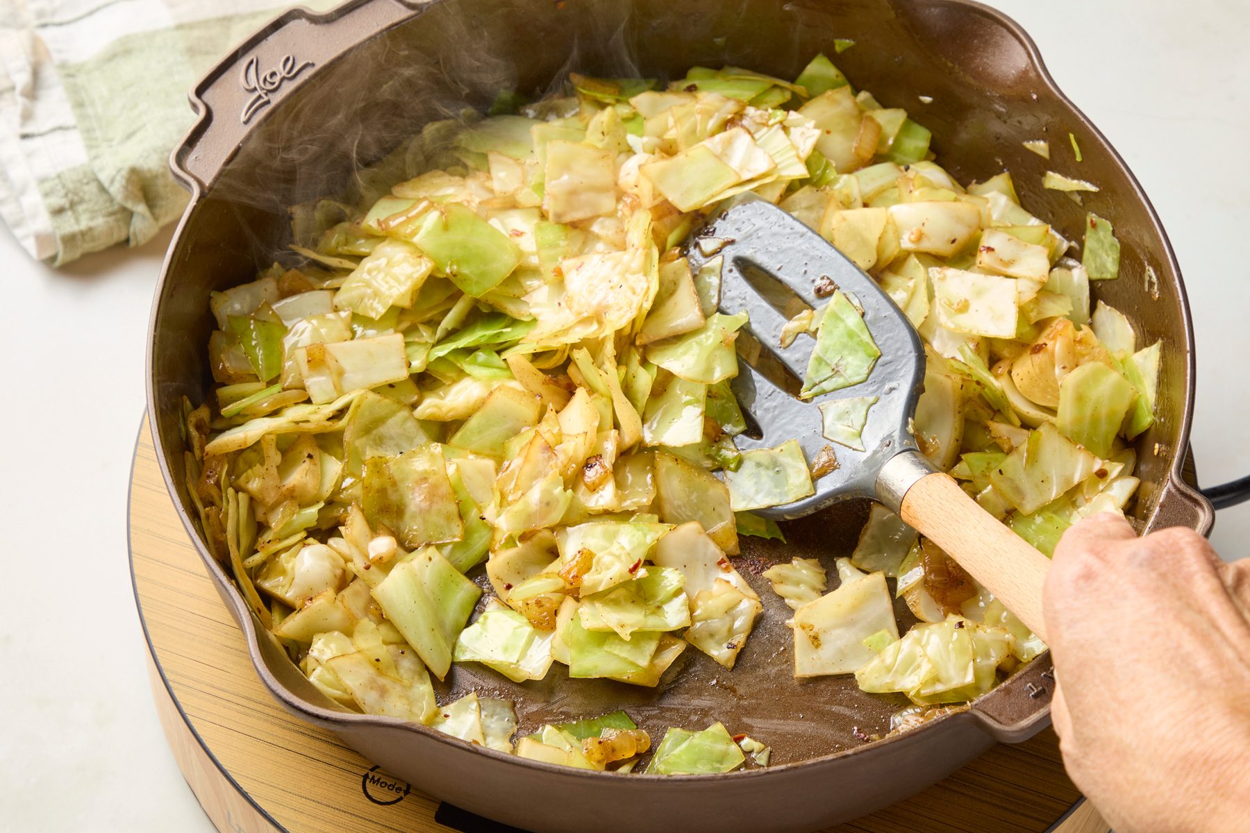 Add cabbage and water; cook