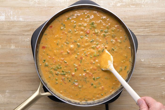 Vegetables, cream, chicken stock and seasonings mixed in a skillet