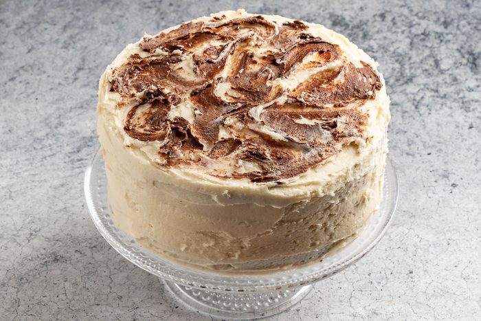 Taste of Home Marble Cake photo of adding the chocolate decoration.