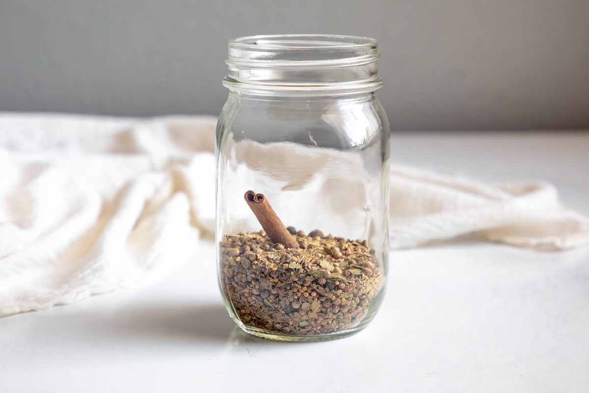 Beauty shot for Taste of Home Pickling Spice with all ingredients in a mason jar.