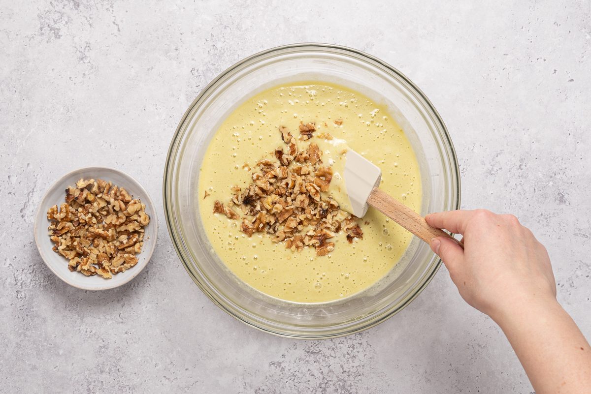 Chopped Walnuts Mixed Inside Pistachio Cake Batter