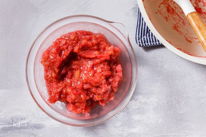 Overhead shot of transfer to a bowl; cool slightly; refrigerate until cold; grey surface;