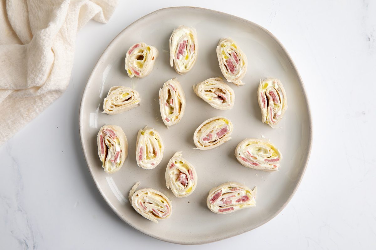 Beauty Shot For Taste Of Home Salami Roll Ups Being Served On A Large Plate.