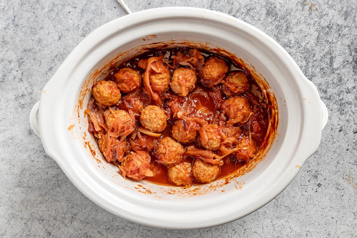 Taste of Home Sauerkraut Meatballs photo of the cooked meatballs in the slow cooker.