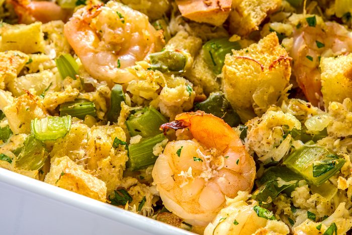 close shot of a white baking dish filled with a seafood stuffing