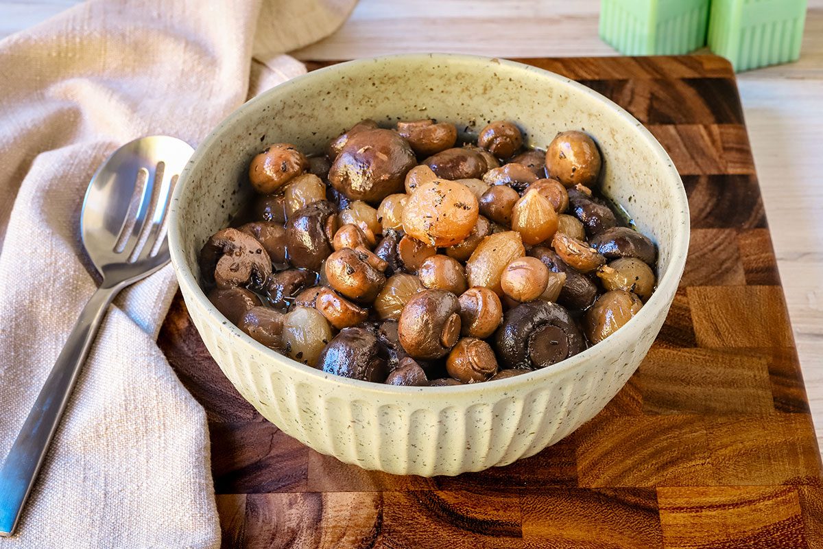 A serving bowl with slow cooker mushrooms, a recipe from Taste of Home.