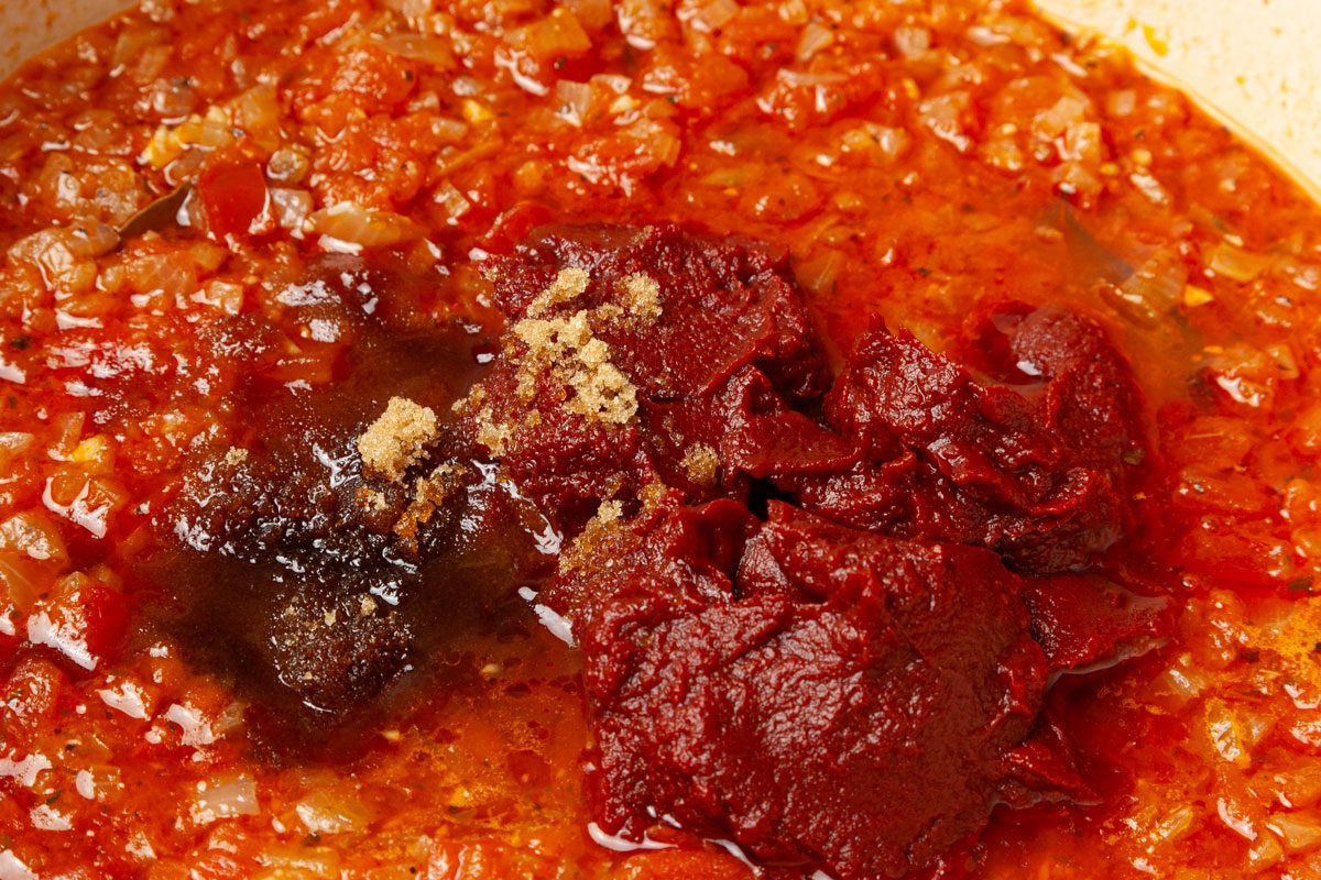 Step 3 of Taste of Home Spaghetti Sauce Without Meat is to add the toamto paste and brown sugar
