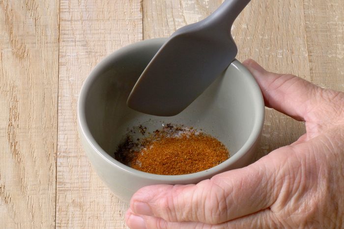 pepper, oil, salt and seafood seasoning whisked in a bowl