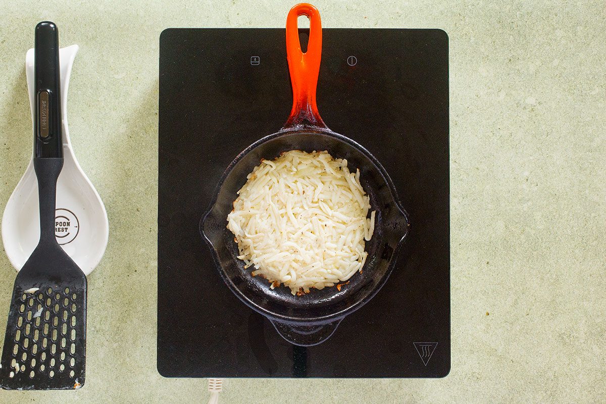 Hash browns cooking on skillet