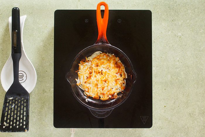 Hash browns flipped on skillet