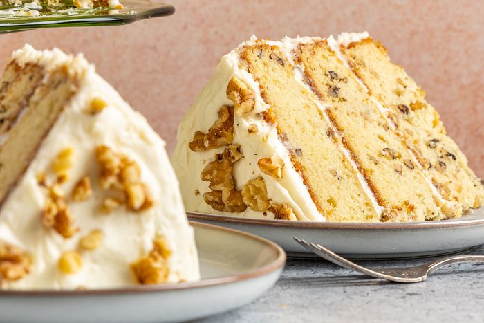 Taste of Home Walnut Cake photo of the final recipe cut into slices and served on plates.