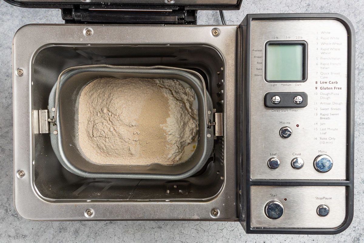 Taste of Home Whole Wheat Bread Machine recipe photo of placing all the ingredients in the bread machine.