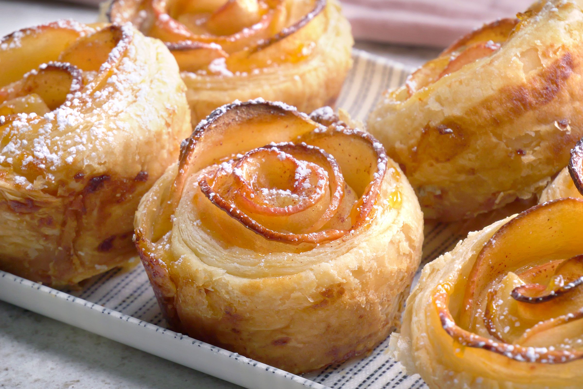 Apple Roses sprinkled with confectioners' sugar