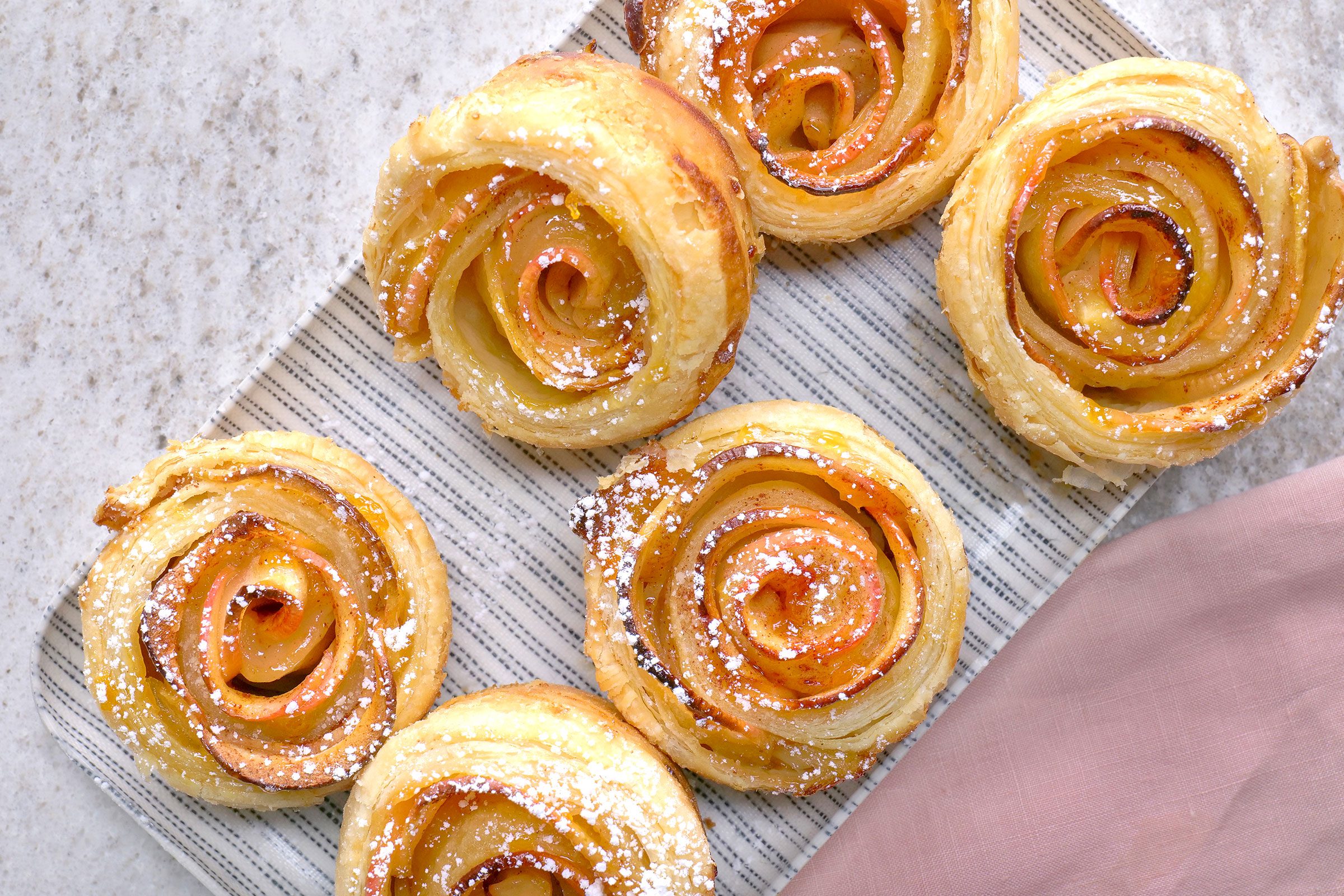 Apple Roses sprinkled with confectioners' sugar