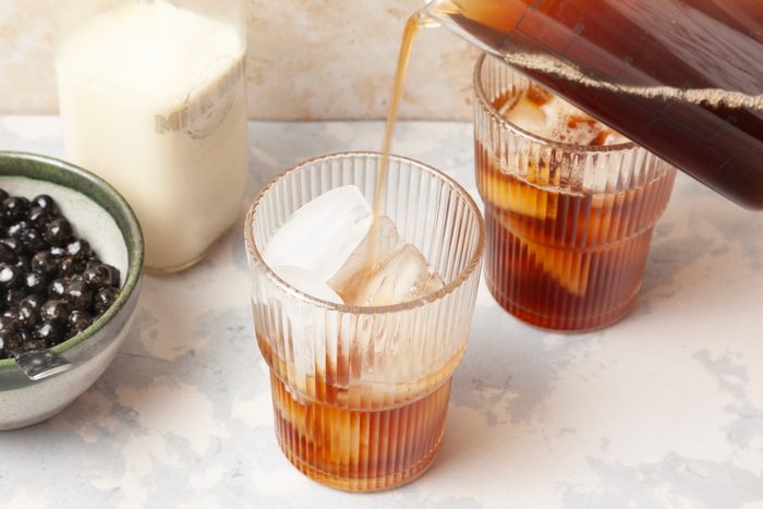 tea being poured over ice