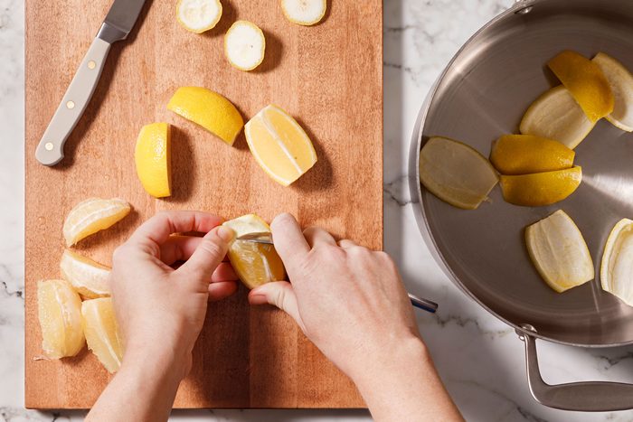 With a sharp knife, trim off both ends of lemon and cut into four wedge-shaped sections