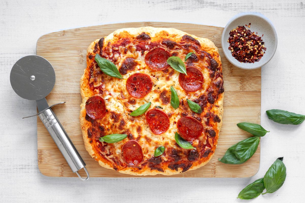 pizza transferred to cutting board