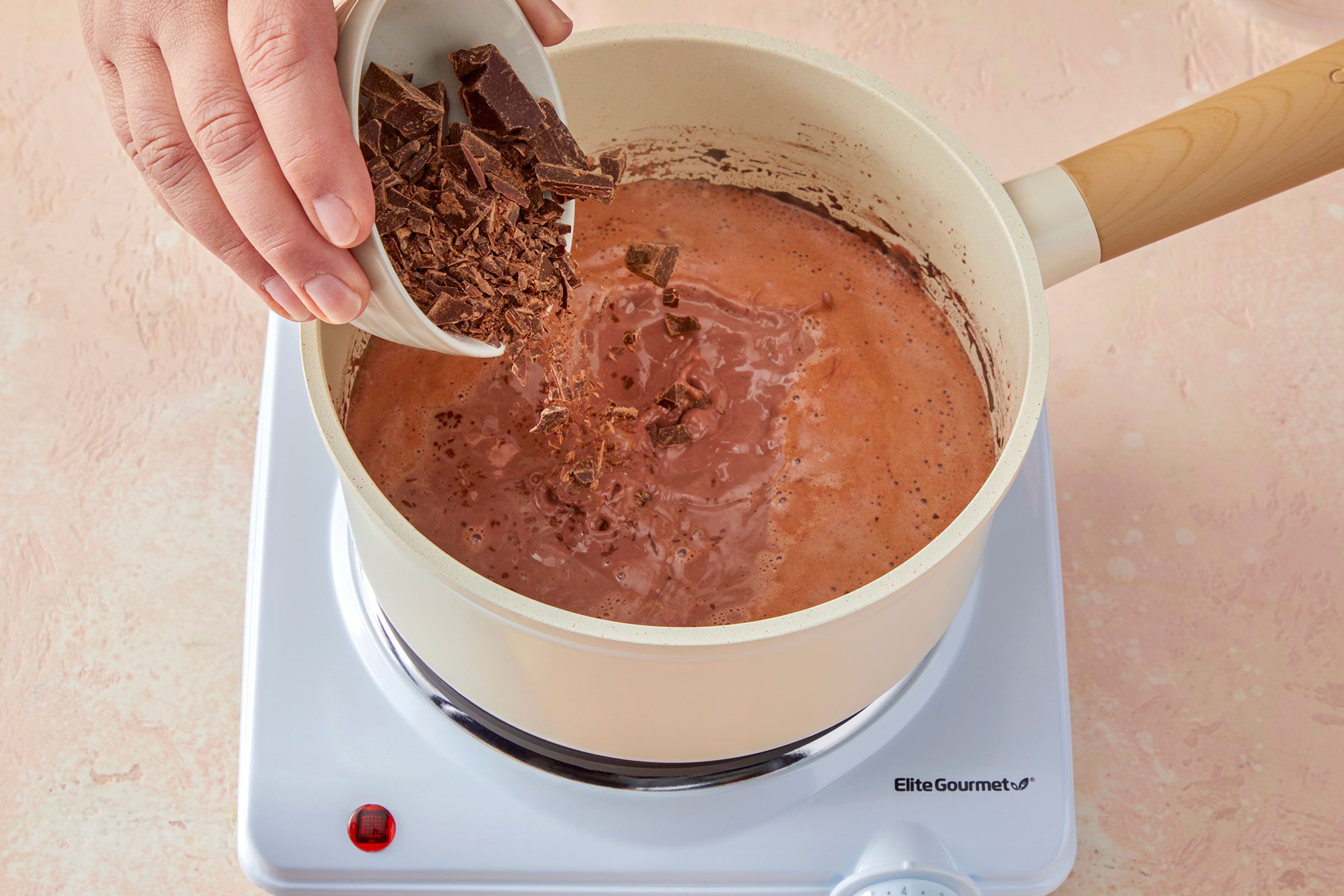 Chopped semisweet chocolate added to the hot milk and cocoa mixture