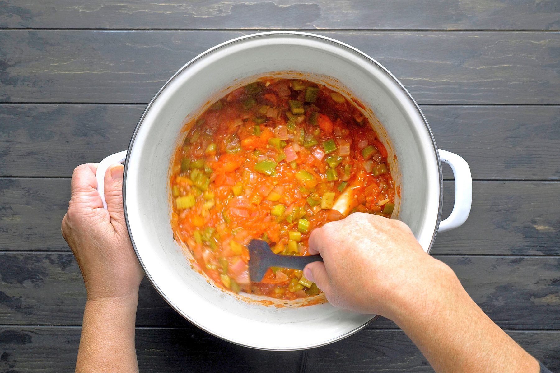 Simmer over medium-low heat until tomatoes and peppers are very soft.