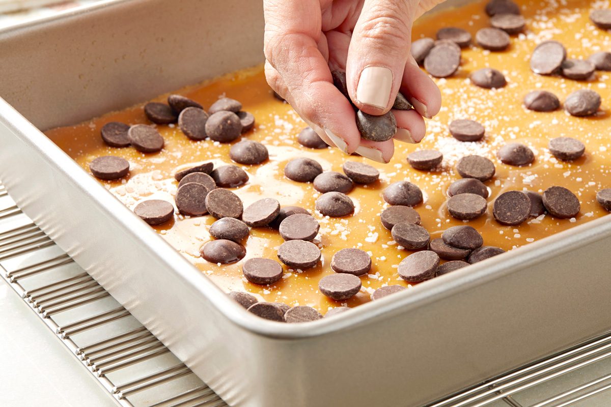 salt and chocolate chips being sprinkled