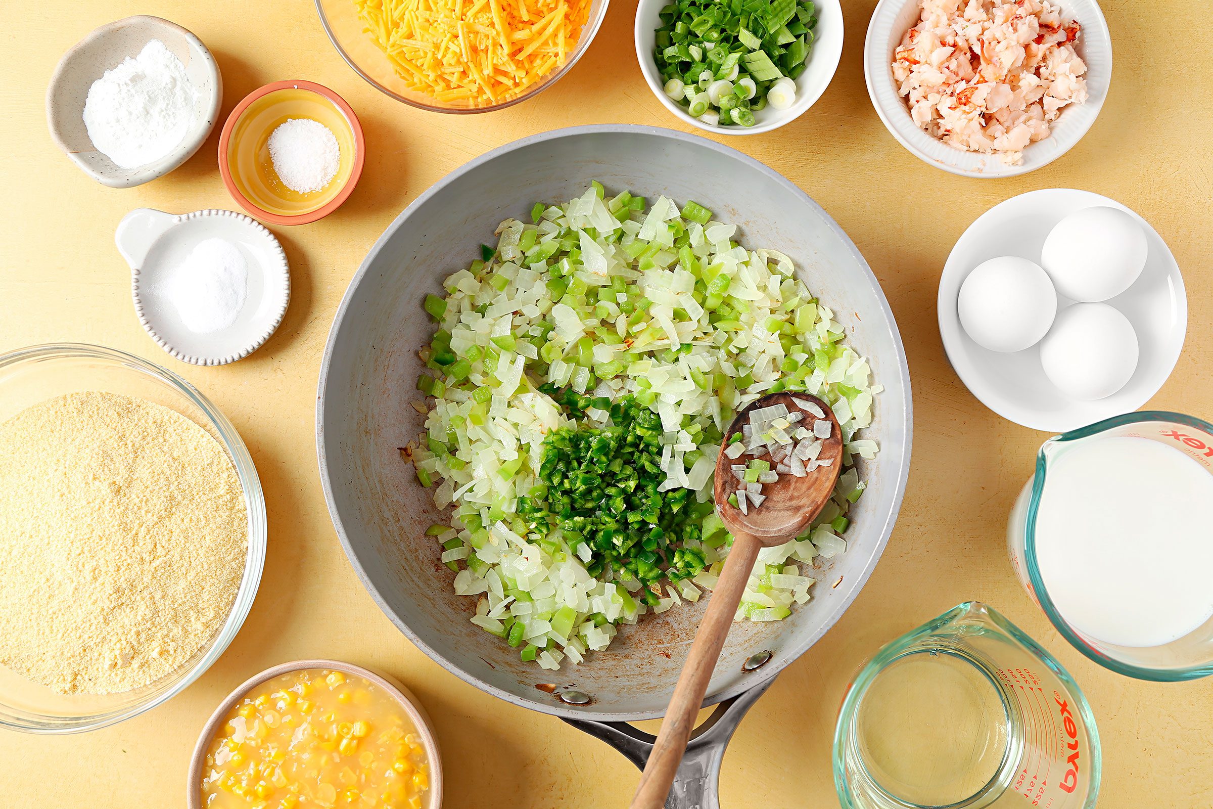 Onions and green pepper sauté in a skillet with some oil