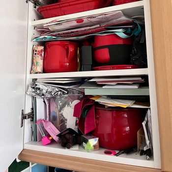 Cluttered cupboard