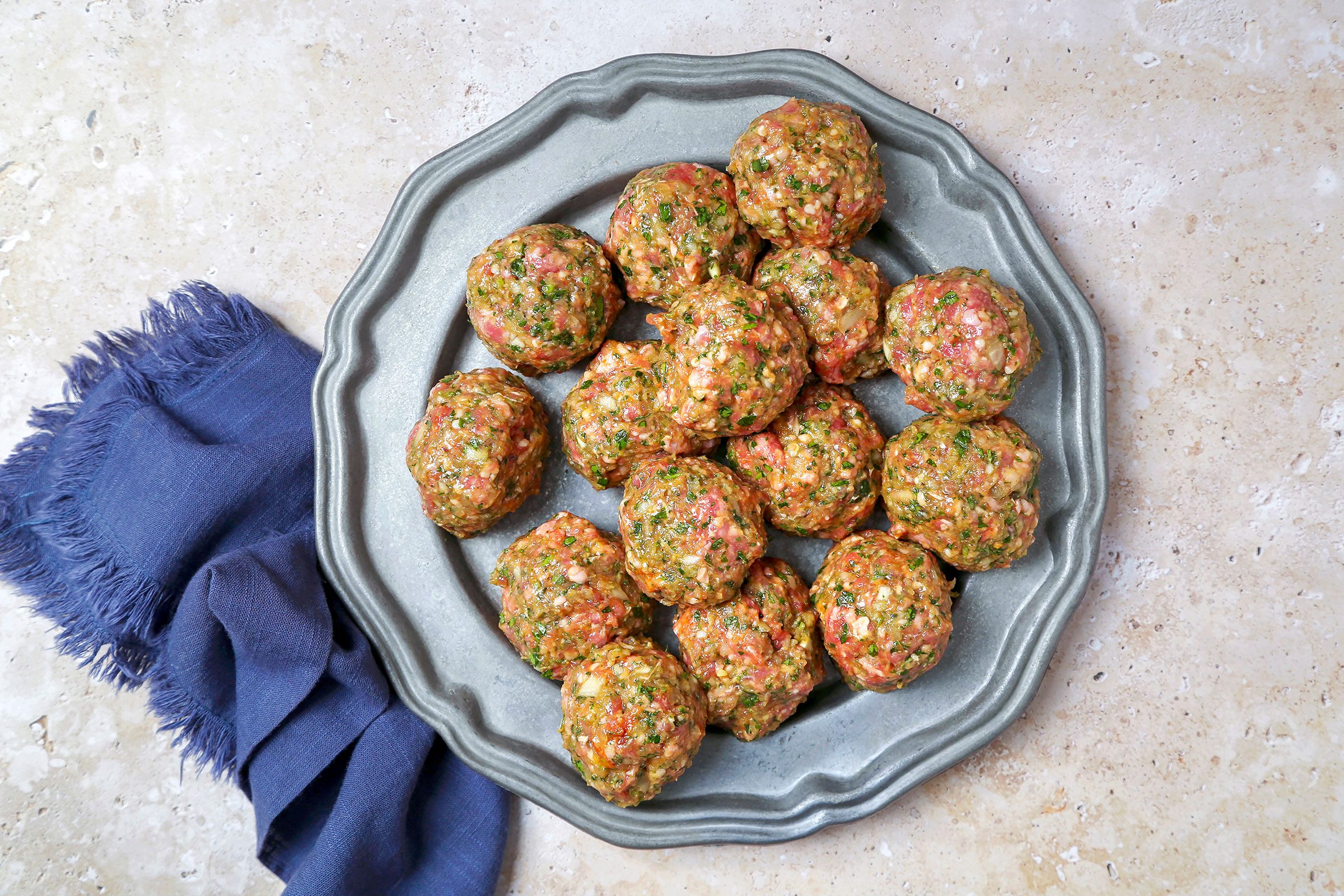 Evenly sized round meat balls in a plate