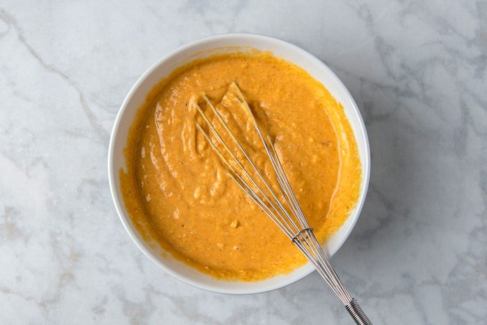 Overhead shot of stir into dry ingredients just until moistened; Let sit 5 minutes; whisk tool; marble surface