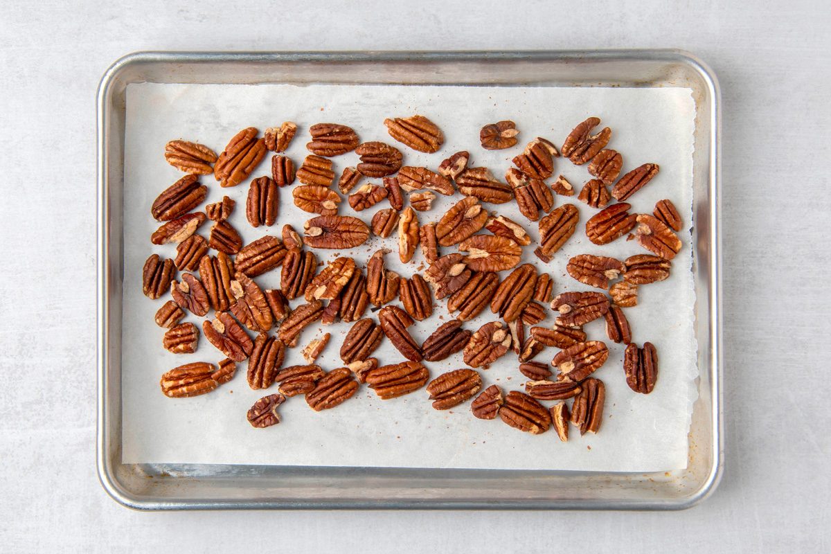 pecans on a baking sheet