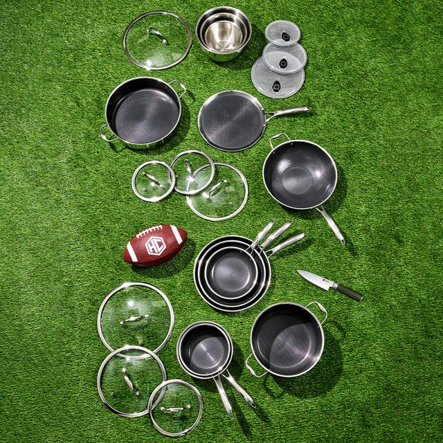 pots, pans, lids, and a football on astroturf