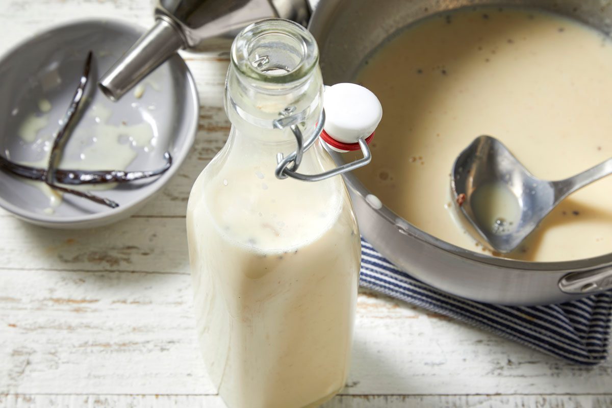 Close shot of discard vanilla bean; store in an airtight container in the refrigerator up to 4 days; Stir before using; wodoen surface;