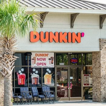 Dunkin' restaurant with palm tree in front