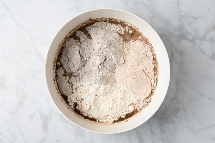 brown sugar, molasses, caraway seeds, oil, salt added to yeast dissolved ins arm water